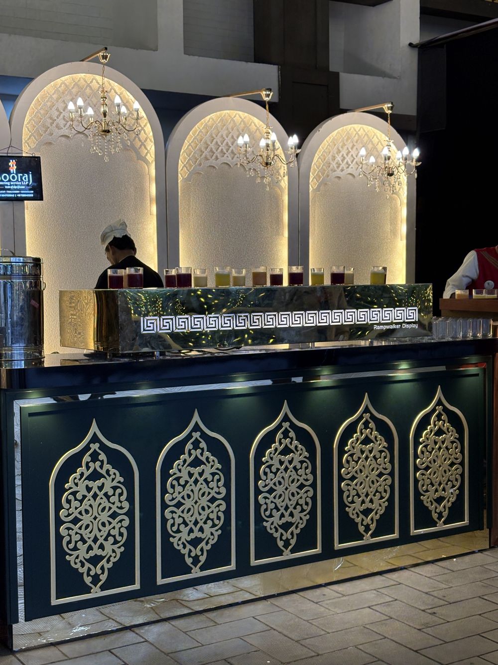 A buffet counter with three lit arches