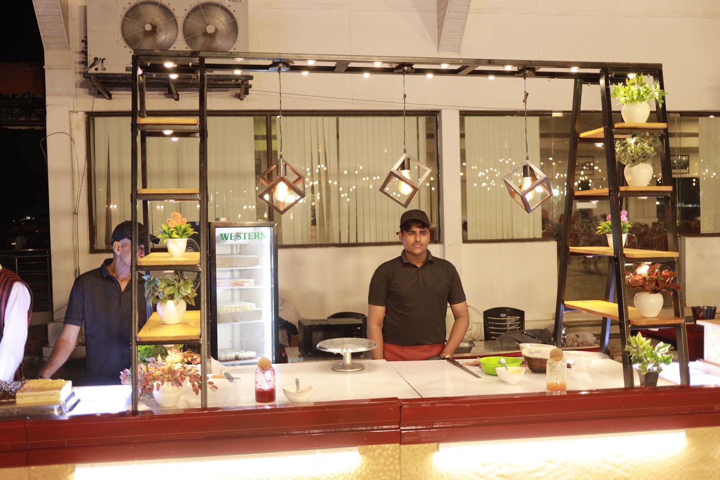 A live cooking station with a chef ready at the counter
